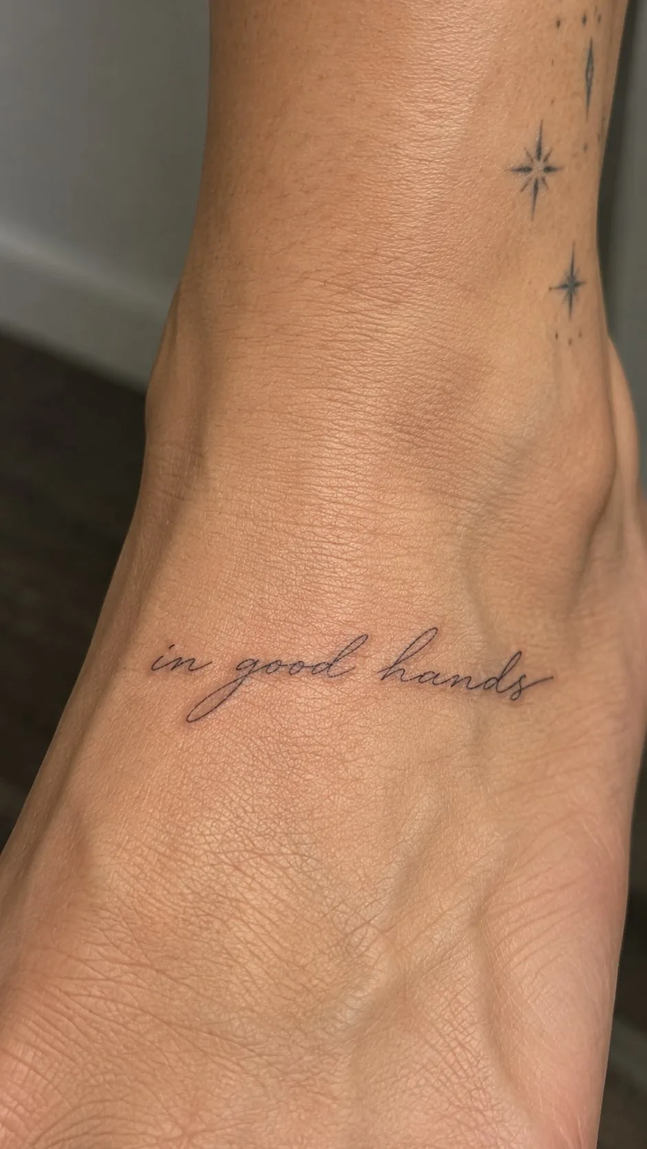 Script tattoo reading in good hands on the foot