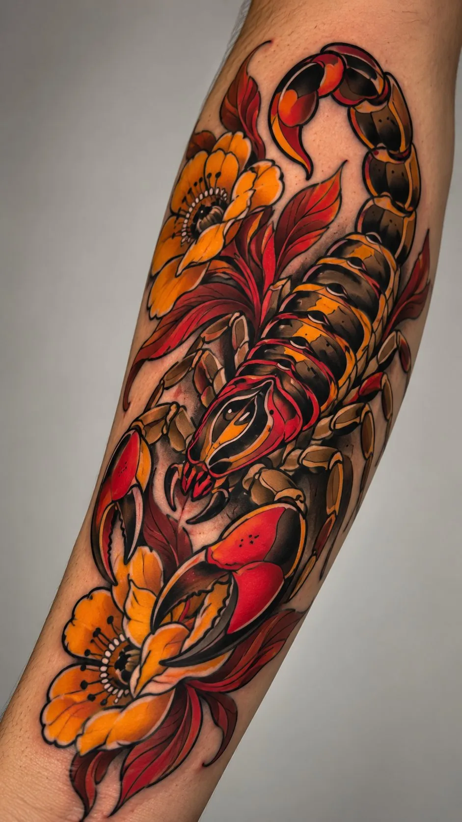 Neo-traditional scorpion and flowers forearm tattoo